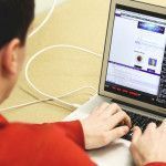 Working in front of the computer.