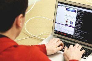 Working in front of the computer.